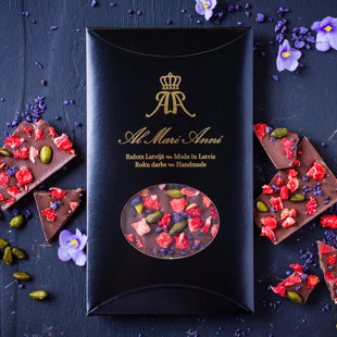 Milk chocolate with freeze-dried strawberries, pistachios and violets