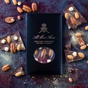 Dark chocolate with handpicked pecans, hazelnuts, almonds and edible gold